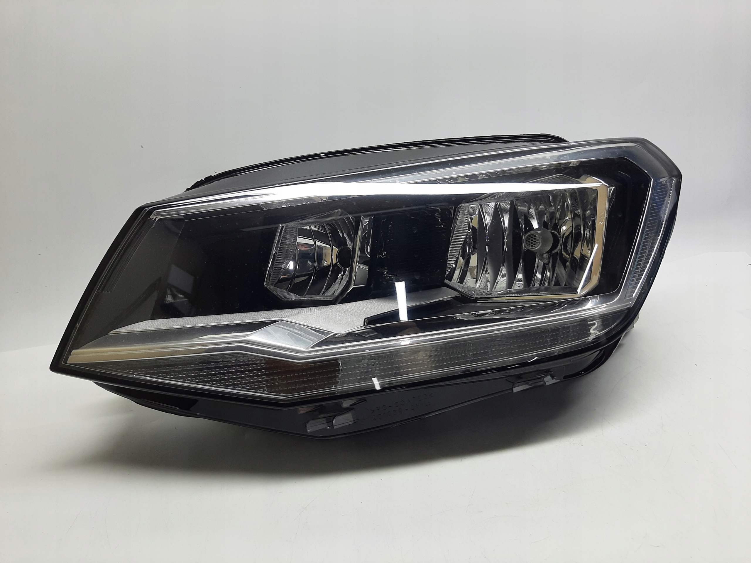 VW Caddy Reflektor Lampa Nowa Hella LEWA 2K1941005C